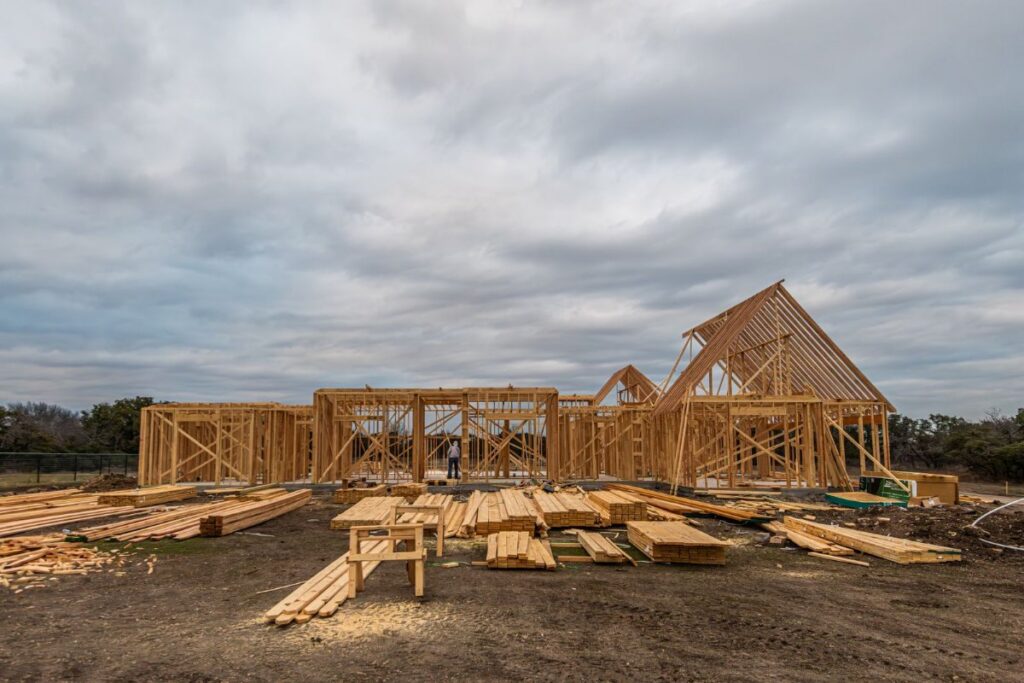 New home framing under construction — Wisconsin construction-to-permanent loan
